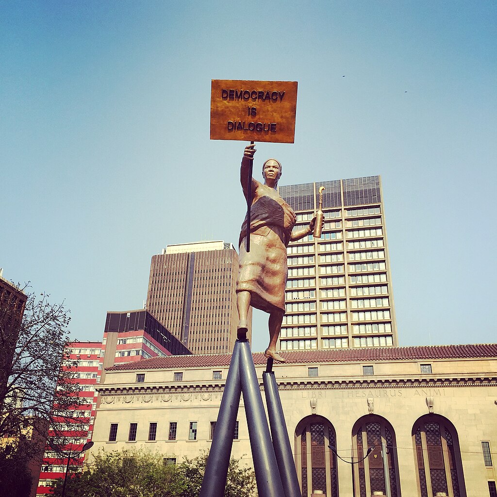 South Africa. Source: Tamaryn Shepherd, https://upload.wikimedia.org/wikipedia/commons/thumb/2/25/Democracy_is_Dialogue.JPG/1024px-Democracy_is_Dialogue.JPG